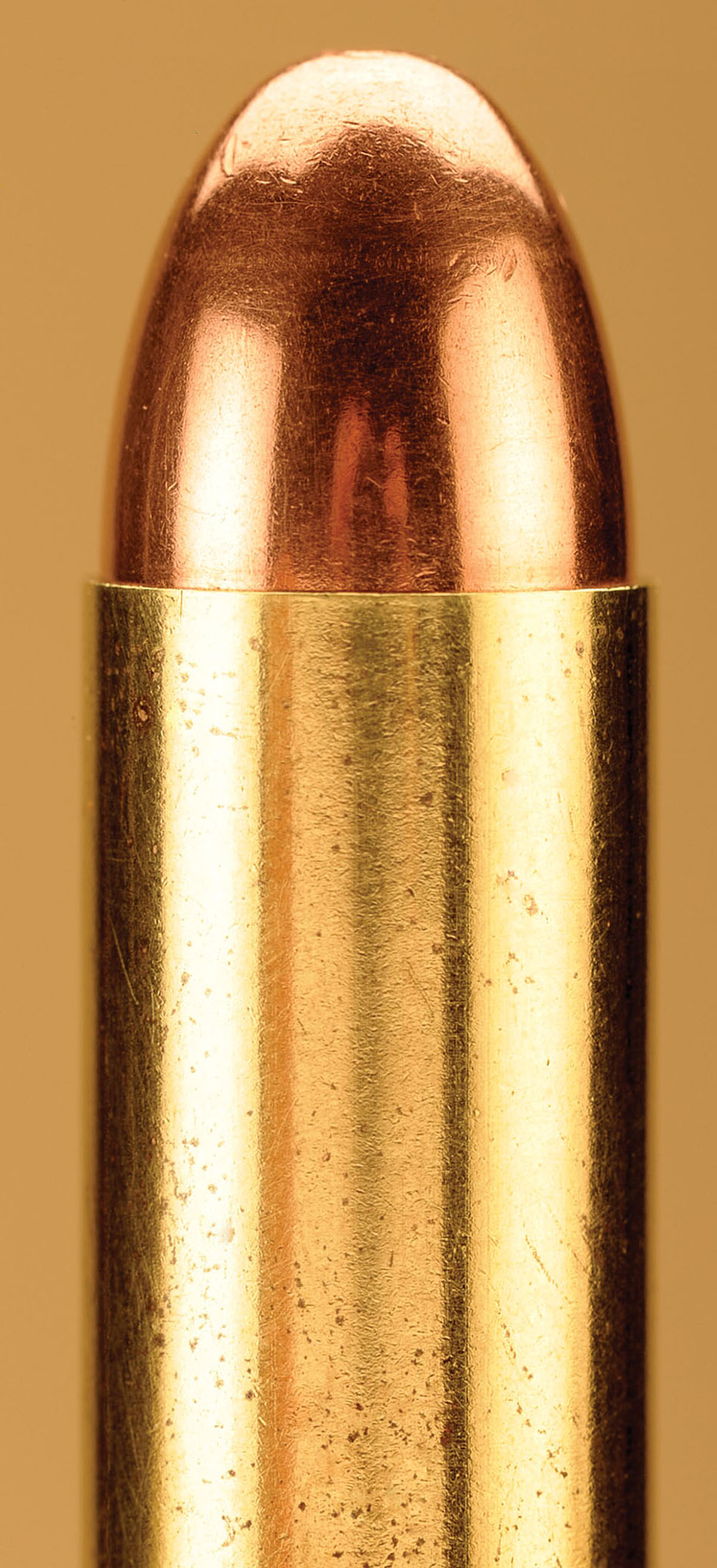 This is the proper way to end up with a finished round. The taper crimp is perfect, and to see the effect, look at the right and left-hand sides of where the case meets the bullet. Just a very small taper to hold the bullet in place during shooting.